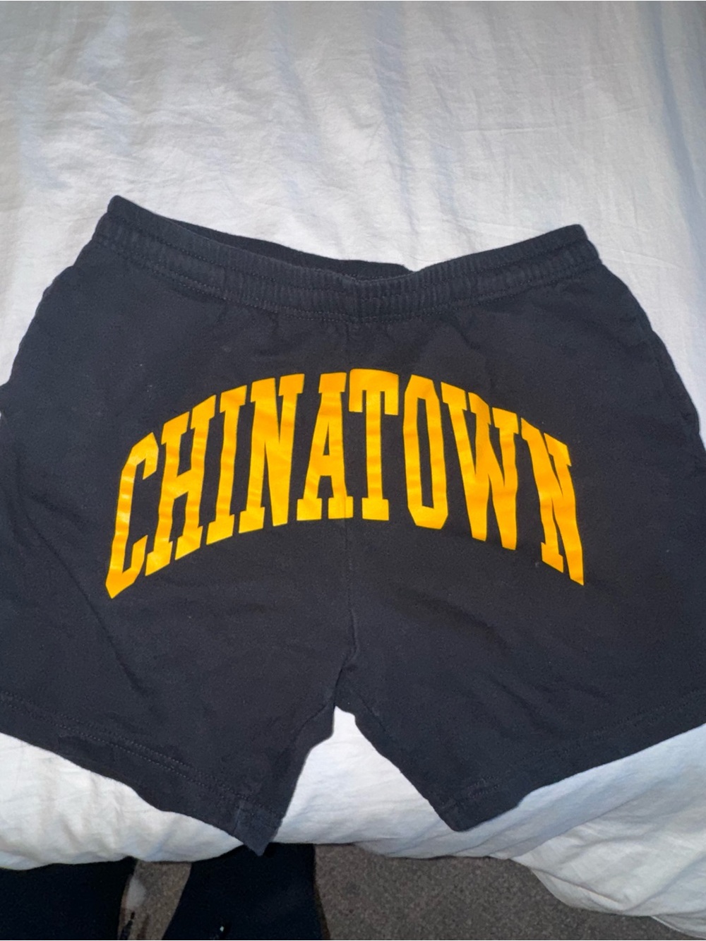 Black Men’s Athletic Shorts with Yellow CHINATOWN Arch Graphic